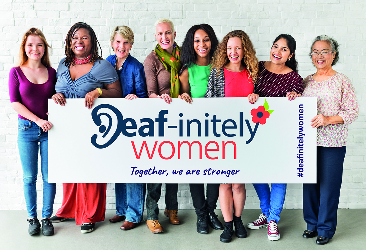 Women holding a Deafinitey Women banner