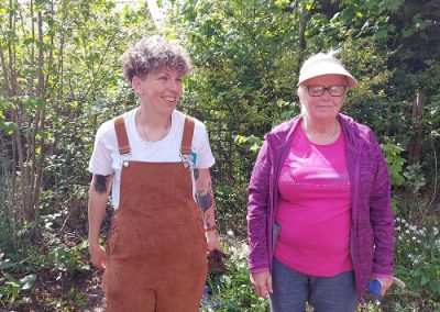 Two women stood in a garden