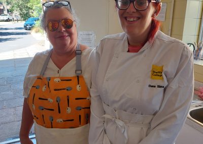 2 deaf women wearing chef outfit
