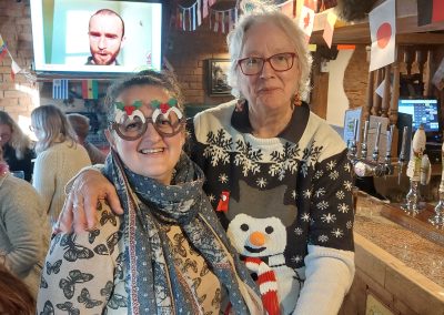 Staff Christmas meal 2022 - Two women in Xmas jumper