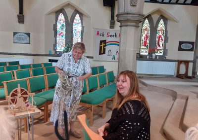 Group inside church with training showing the sally rope