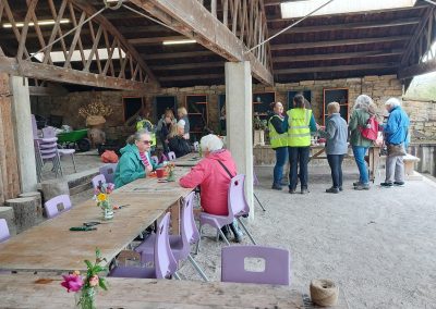 Group in the background with tables and flower workshop