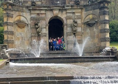 Group photo behind water fountain