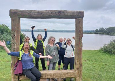 Group photo with wooden frame with Carsington Water background.