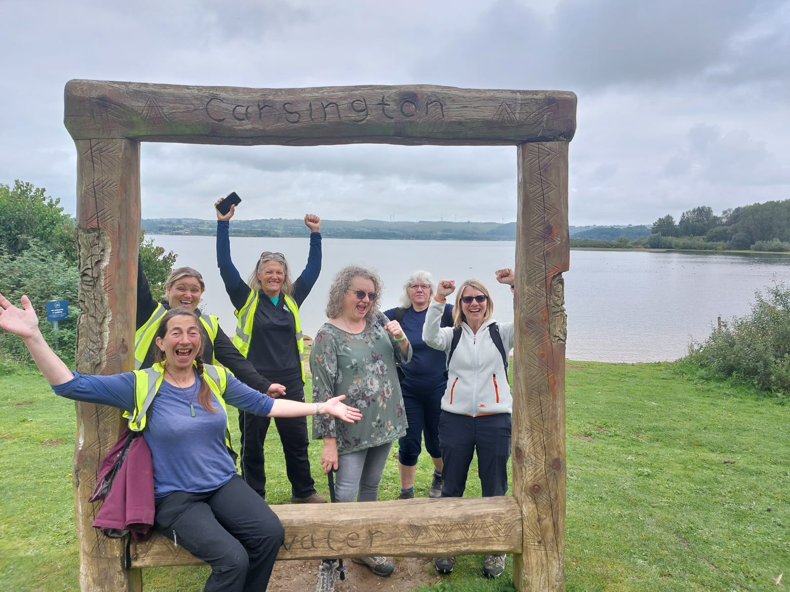Group photo with wooden frame with Carsington Water background.