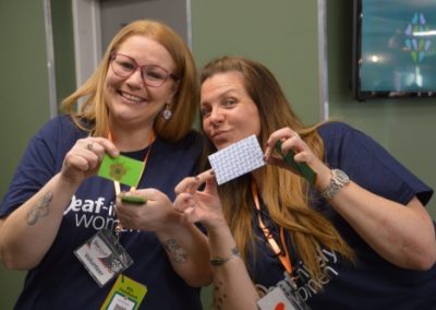 team members smiling at the camera at an event